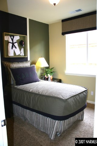 530 Seattle Slew Court Reno, NV 89521 - Photo 8 of 9 a bedroom with a bed and a painting on the wall