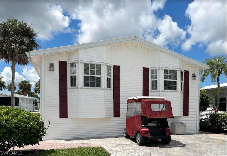 554 Cattleya Refuge, Unit 554 Naples, FL 34114 - Photo 1 of 49 a car parked in front of house