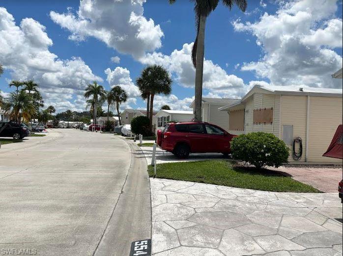 554 Cattleya Refuge, Unit 554 Naples, FL 34114 - Photo 12 of 49 a view of a parked cars in front of a house