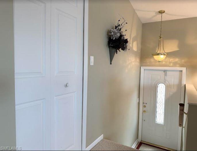 554 Cattleya Refuge, Unit 554 Naples, FL 34114 - Photo 16 of 49 a view of a bathroom with a shower and a mirror