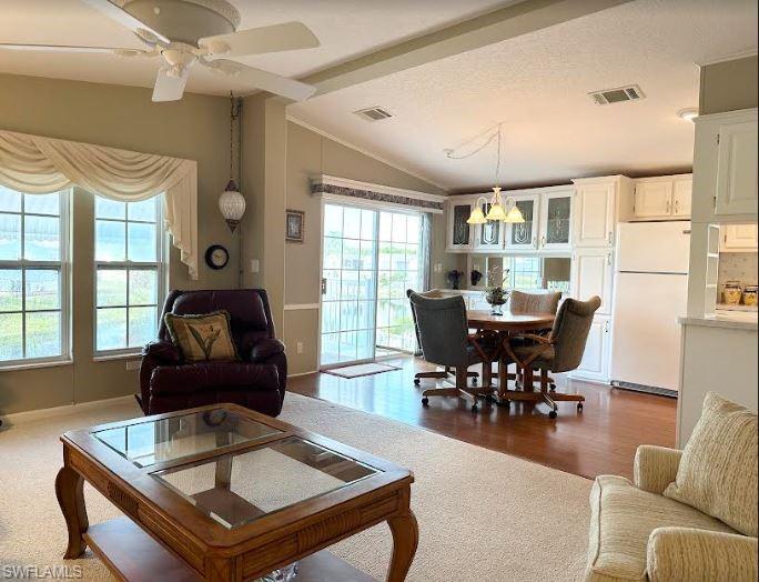 554 Cattleya Refuge, Unit 554 Naples, FL 34114 - Photo 19 of 49 a living room with furniture and a large window