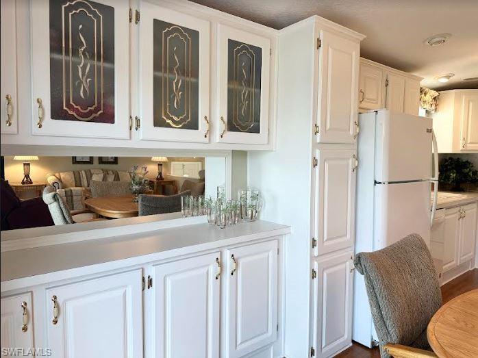 554 Cattleya Refuge, Unit 554 Naples, FL 34114 - Photo 25 of 49 a kitchen with stainless steel appliances granite countertop a refrigerator and a sink