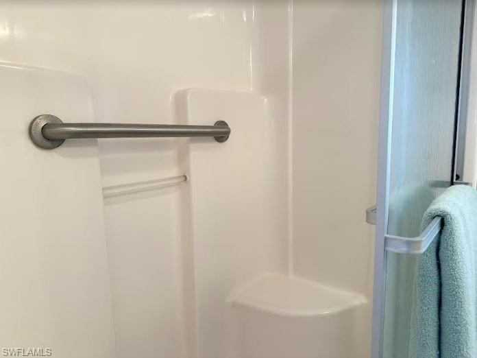 554 Cattleya Refuge, Unit 554 Naples, FL 34114 - Photo 32 of 49 a bathroom with a shower