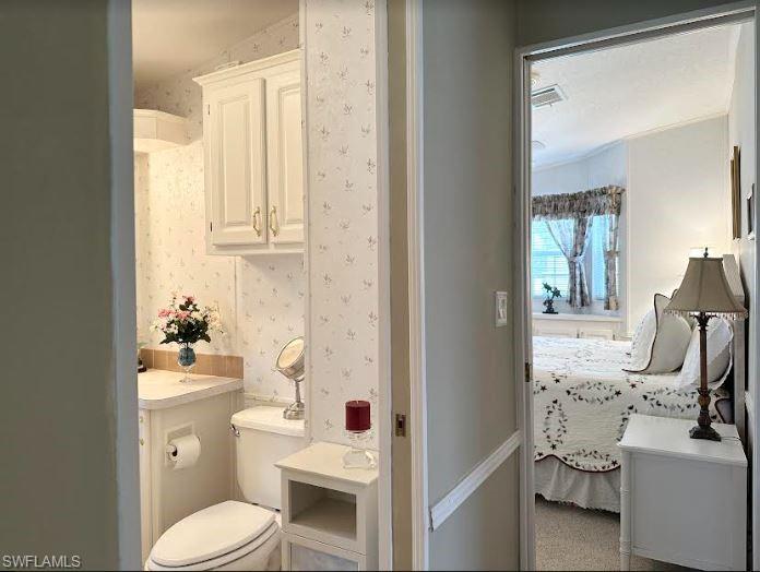 554 Cattleya Refuge, Unit 554 Naples, FL 34114 - Photo 33 of 49 a bathroom with a sink toilet vanity and tub