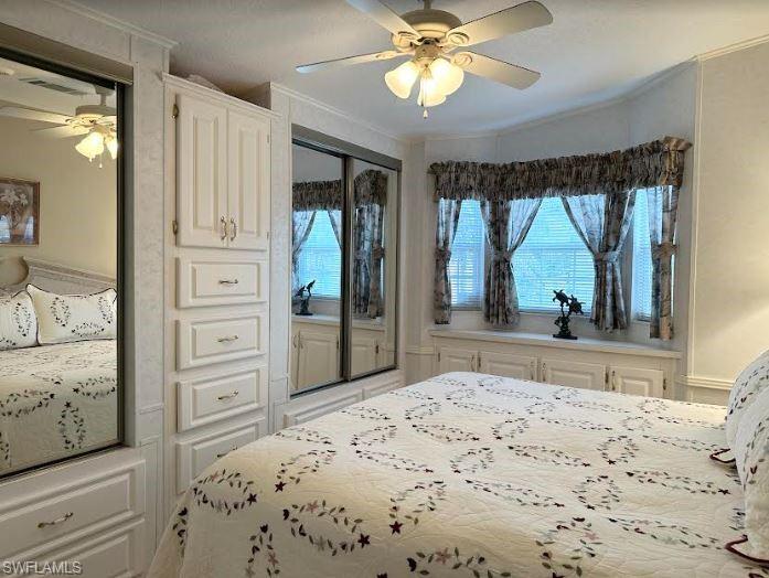 554 Cattleya Refuge, Unit 554 Naples, FL 34114 - Photo 34 of 49 a bedroom with a bed and a flat screen tv