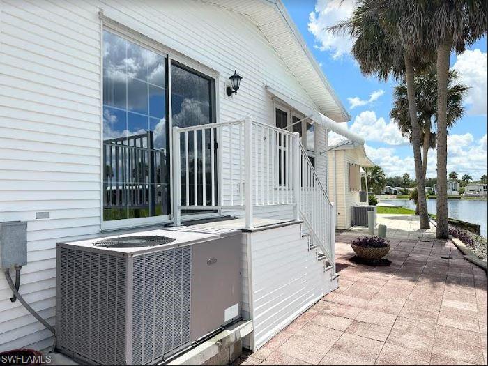 554 Cattleya Refuge, Unit 554 Naples, FL 34114 - Photo 5 of 49 a view of a patio with a table and chairs