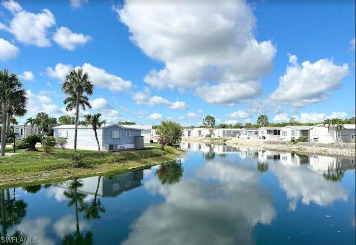 554 Cattleya Refuge, Unit 554 Naples, FL 34114 - Photo 8 of 49 a view of residential houses with outdoor space and lake view