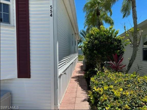 554 Cattleya Refuge, Unit 554 Naples, FL 34114 - Photo 9 of 49 a balcony with potted plants