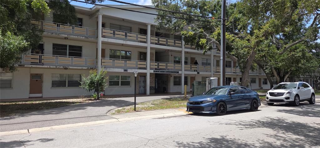 911 Washington Avenue Southwest, Unit 304 Largo, FL 33770 - Photo 2 of 26 a car parked in front of a building