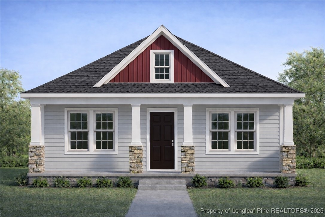 802 Holmes Street Clinton, NC 28328 - Photo 1 of 6 a front view of a house with a yard