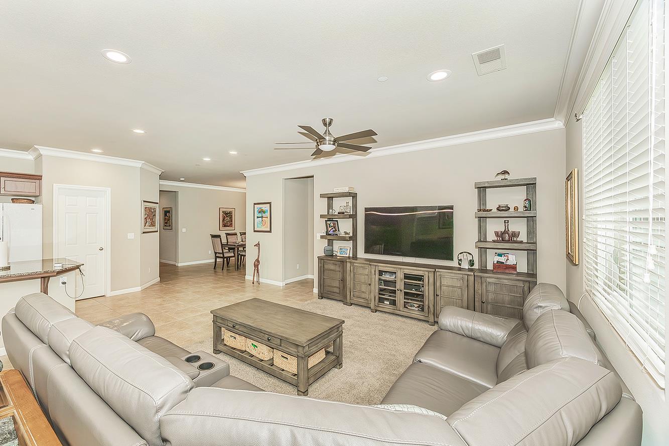 7133 North Generation Drive Fresno, CA 93711 - Photo 11 of 38 a living room with furniture and a flat screen tv