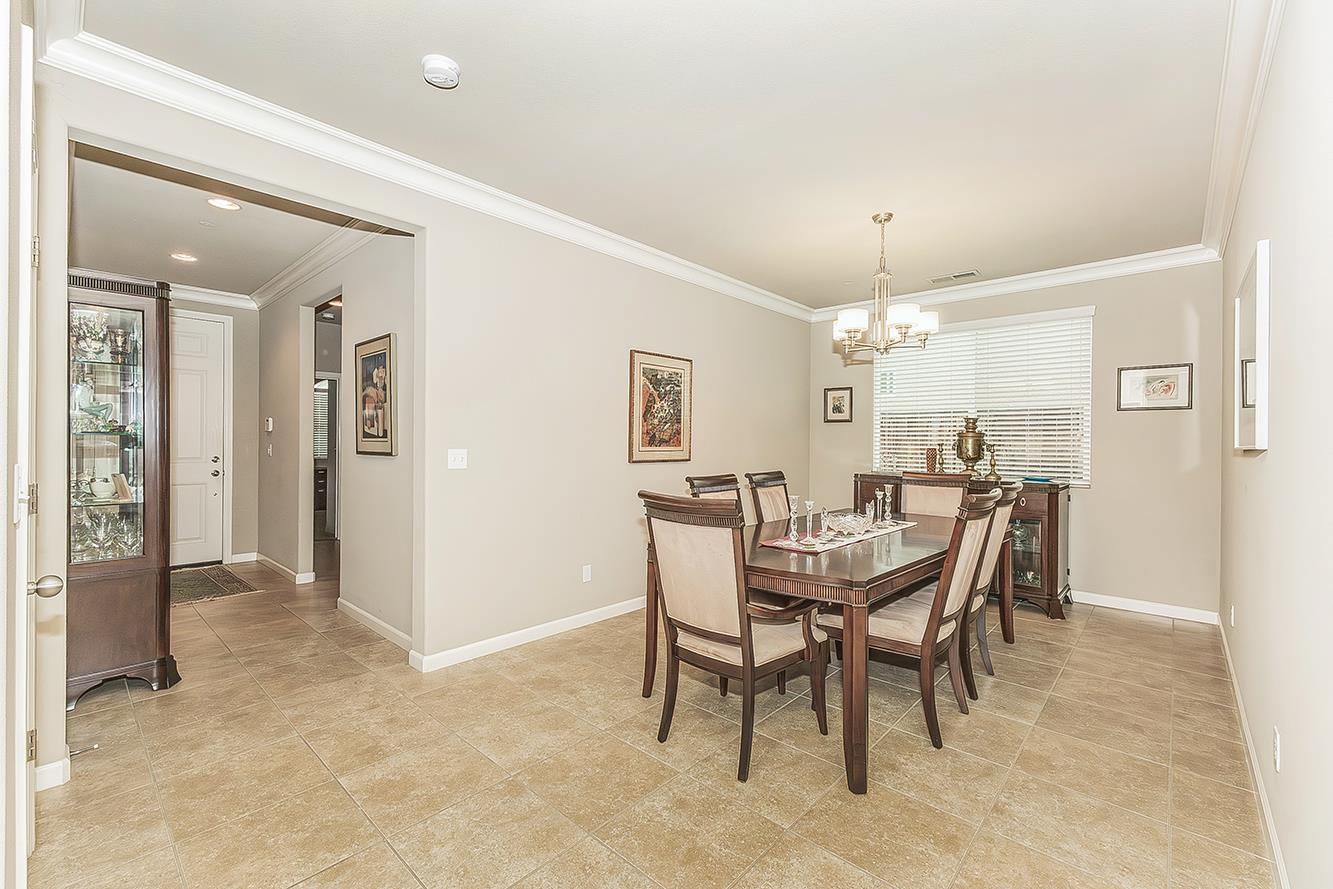 7133 North Generation Drive Fresno, CA 93711 - Photo 14 of 38 a view of a dining room with furniture and window