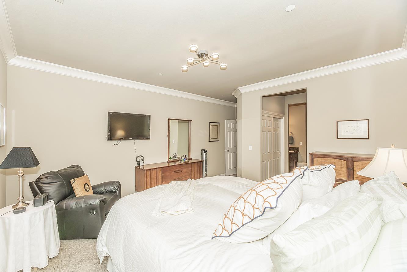 7133 North Generation Drive Fresno, CA 93711 - Photo 20 of 38 a bedroom with a bed and a flat screen tv