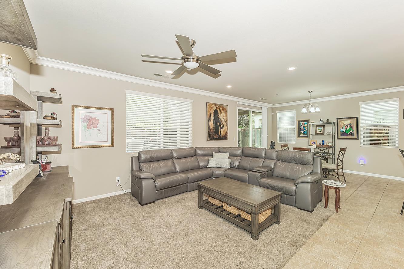 7133 North Generation Drive Fresno, CA 93711 - Photo 9 of 38 a living room with furniture and a large window