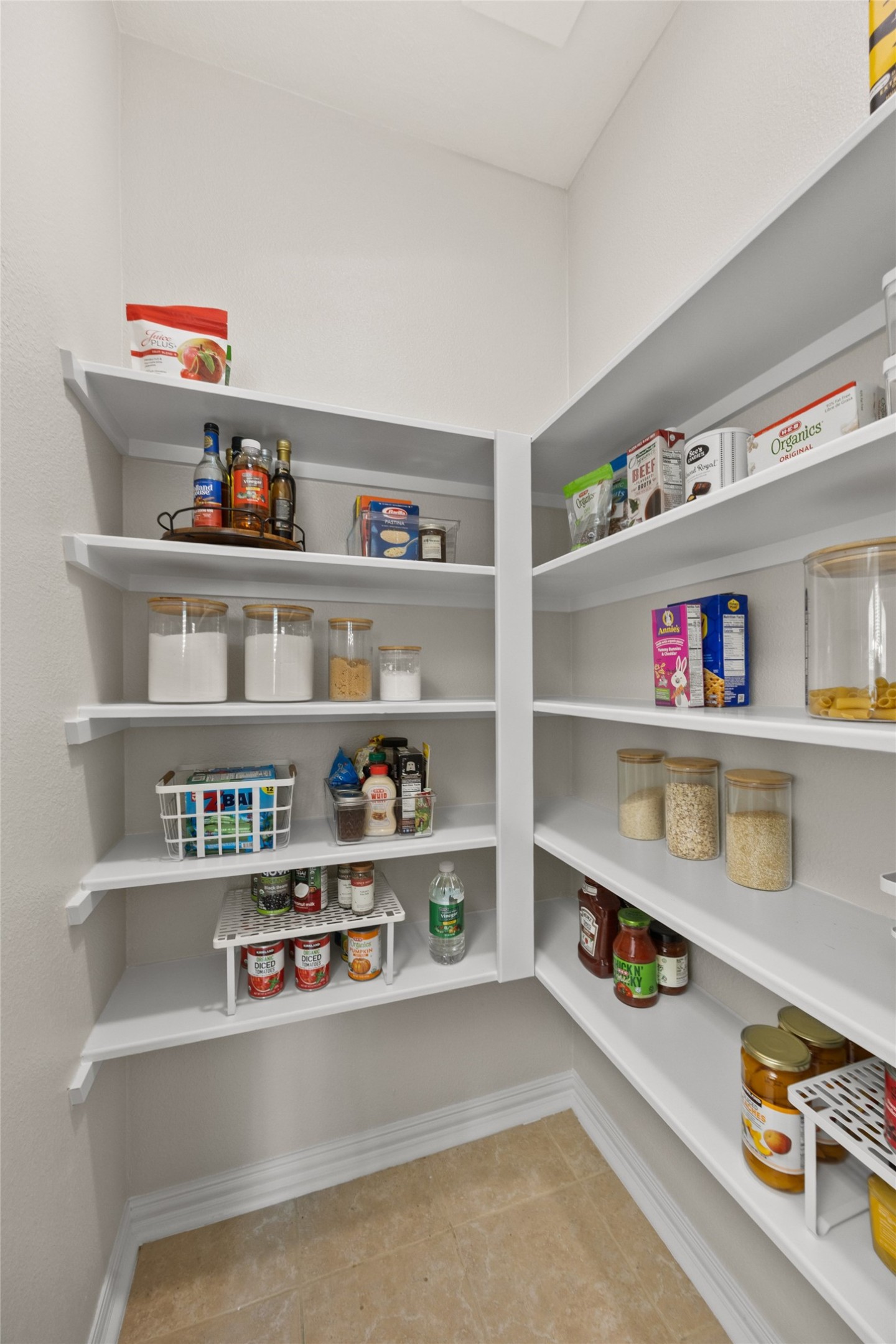 2219 Louetta Brook Lane Spring, TX 77388 - Photo 17 of 34 Walk-in pantry with built-in shelving offering ample storage and organization.