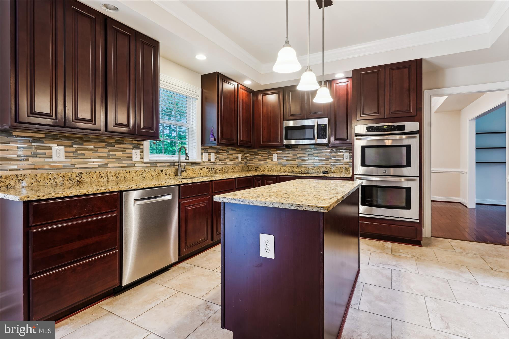 70 Ruby Glen Lane Fredericksburg, VA 22405 - Photo 11 of 72 a kitchen with stainless steel appliances granite countertop wooden cabinets a stove top oven a sink and dishwasher