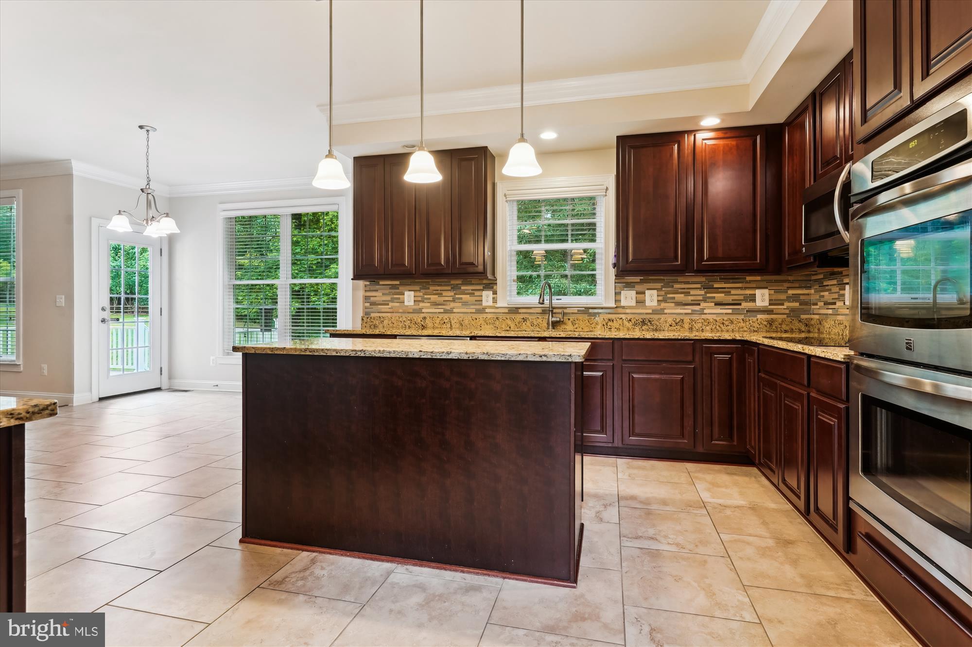 70 Ruby Glen Lane Fredericksburg, VA 22405 - Photo 12 of 72 a kitchen with a sink counter top space appliances and a window