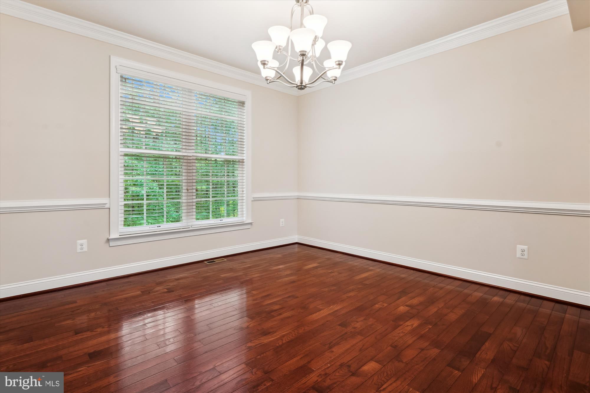 70 Ruby Glen Lane Fredericksburg, VA 22405 - Photo 14 of 72 a view of an empty room with wooden floor and a window