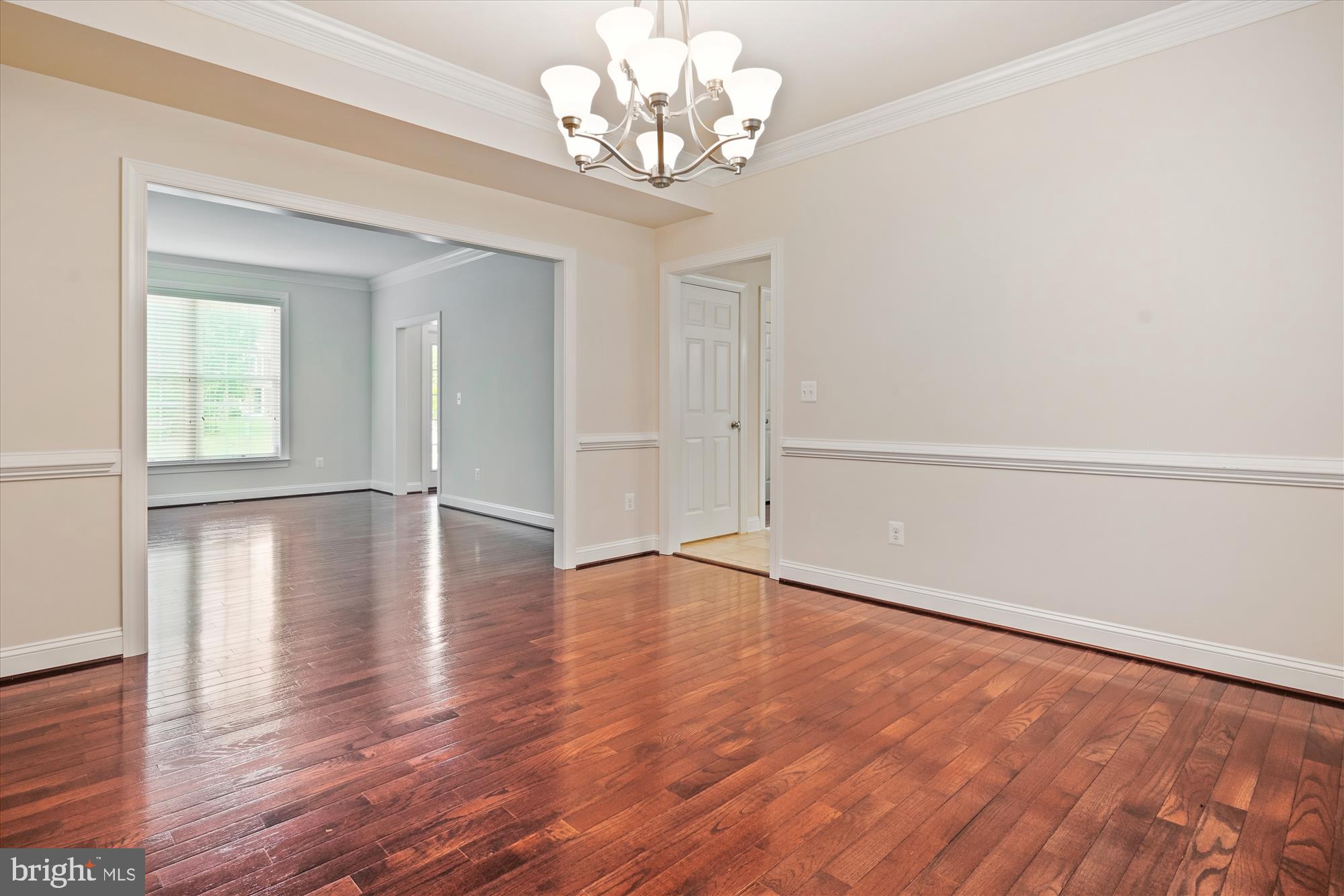 70 Ruby Glen Lane Fredericksburg, VA 22405 - Photo 16 of 72 a view of an empty room with wooden floor and a window
