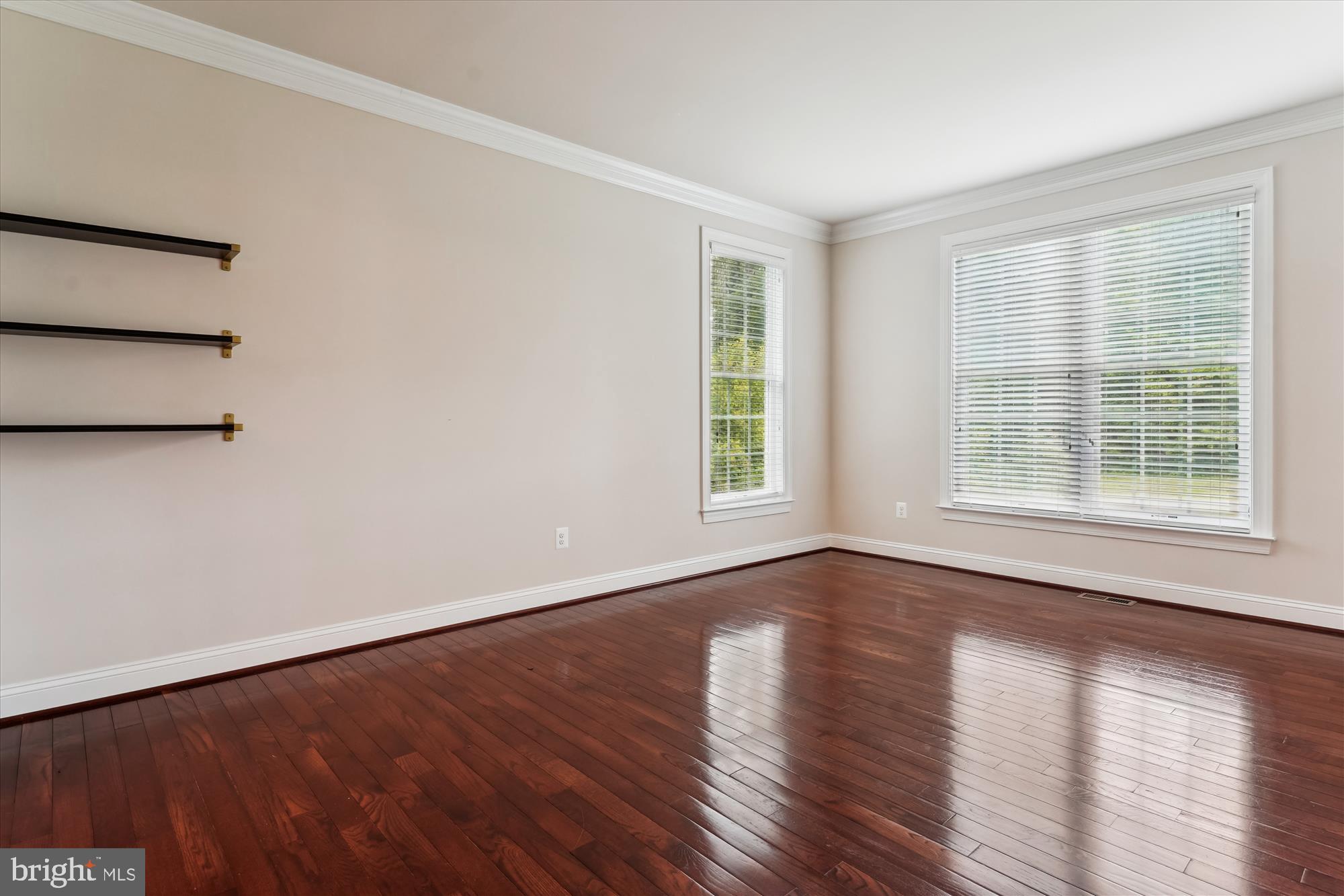 70 Ruby Glen Lane Fredericksburg, VA 22405 - Photo 23 of 72 a view of an empty room with wooden floor and a window
