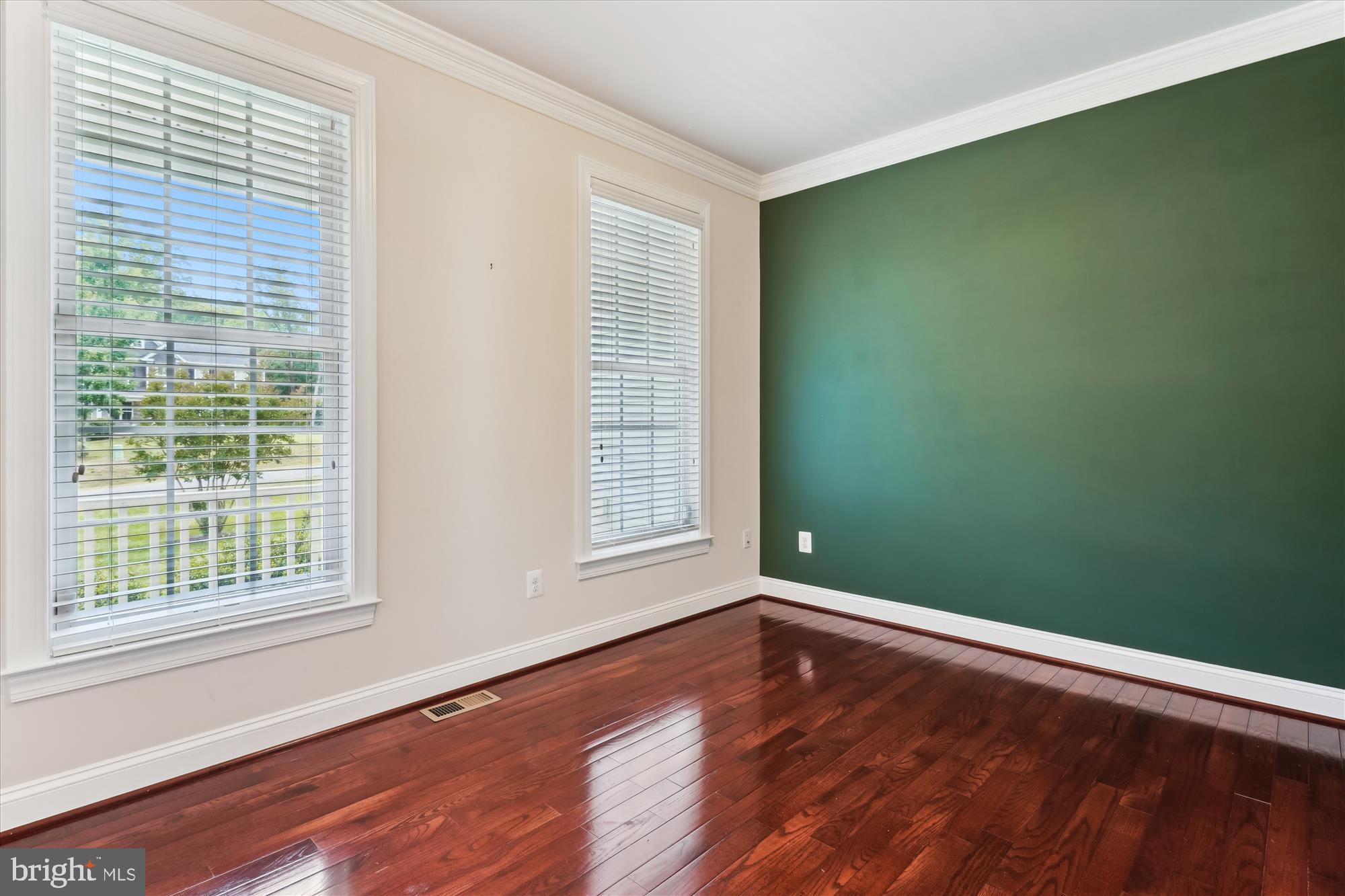 70 Ruby Glen Lane Fredericksburg, VA 22405 - Photo 24 of 72 a view of an empty room with wooden floor and a window