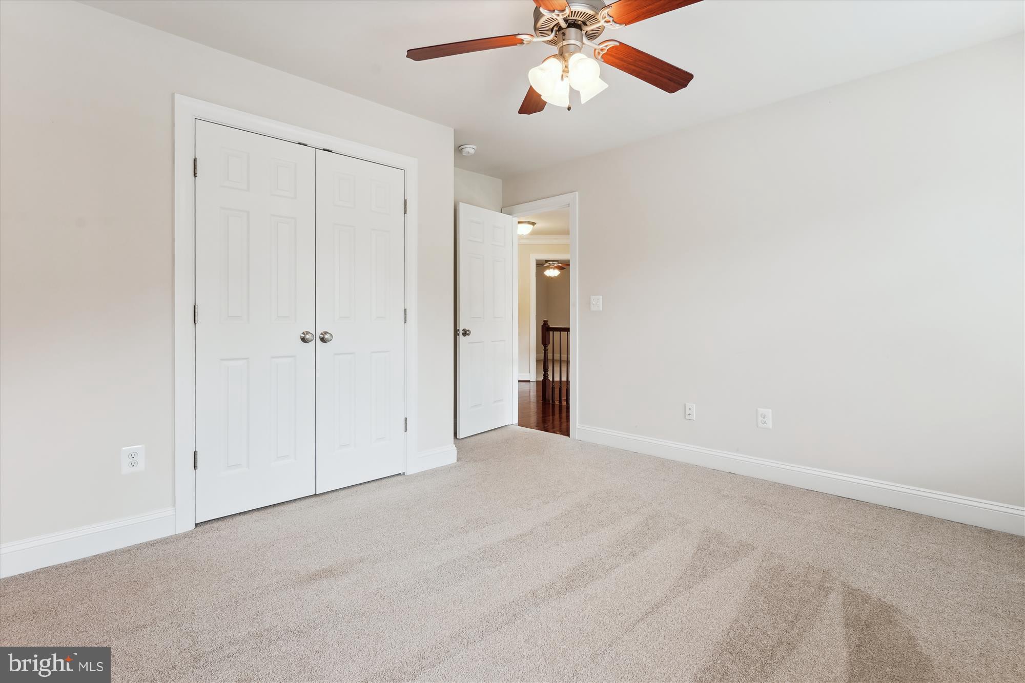 70 Ruby Glen Lane Fredericksburg, VA 22405 - Photo 42 of 72 an empty room with closet and a chandelier fan