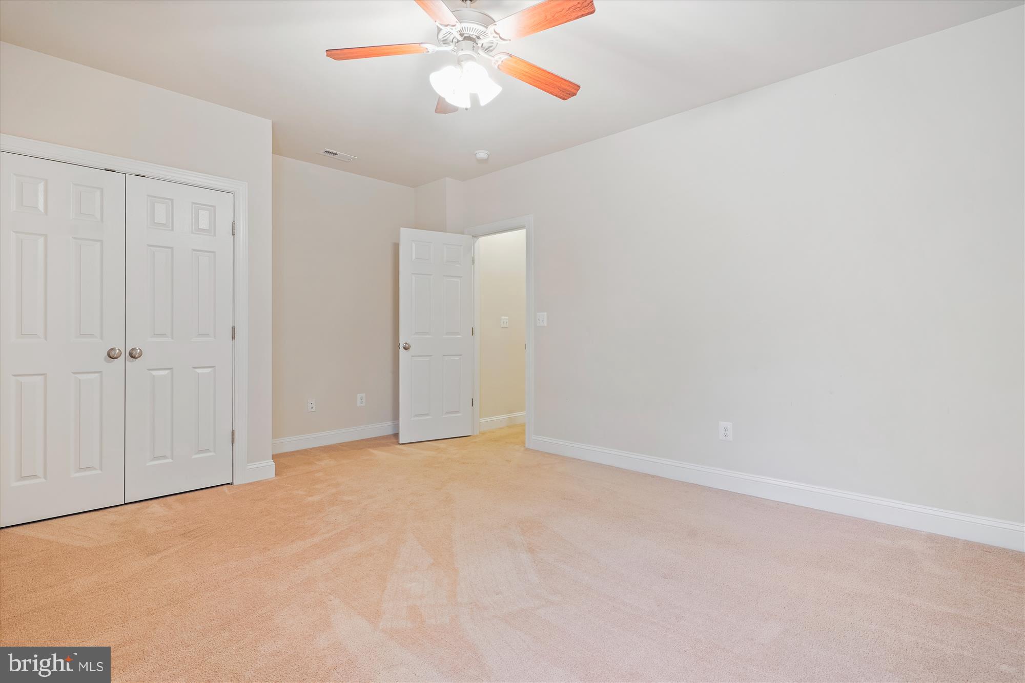70 Ruby Glen Lane Fredericksburg, VA 22405 - Photo 47 of 72 an empty room with a chandelier fan and closet