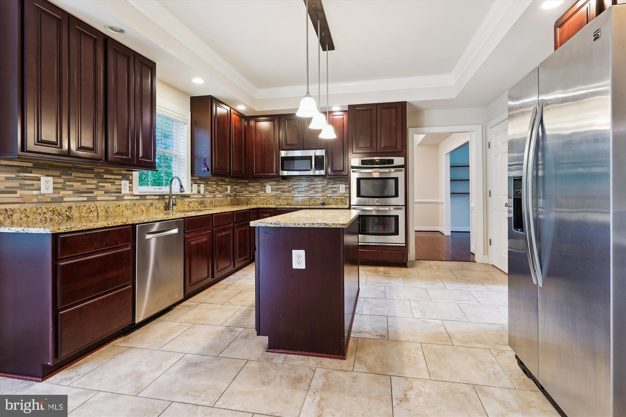 70 Ruby Glen Lane Fredericksburg, VA 22405 - Photo 8 of 72 a kitchen with stainless steel appliances granite countertop a refrigerator and a sink
