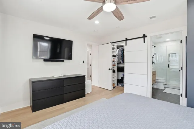 a view of a livingroom with furniture and a flat screen tv