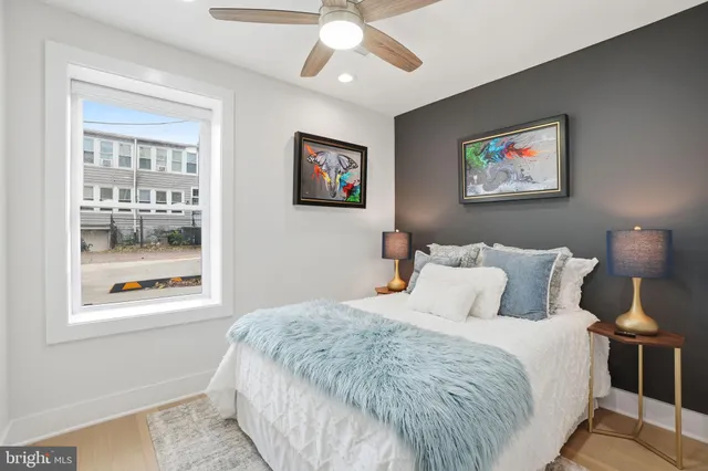 a bedroom with a large bed and a window