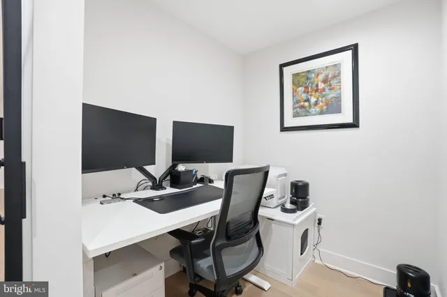 a view of a workspace with furniture