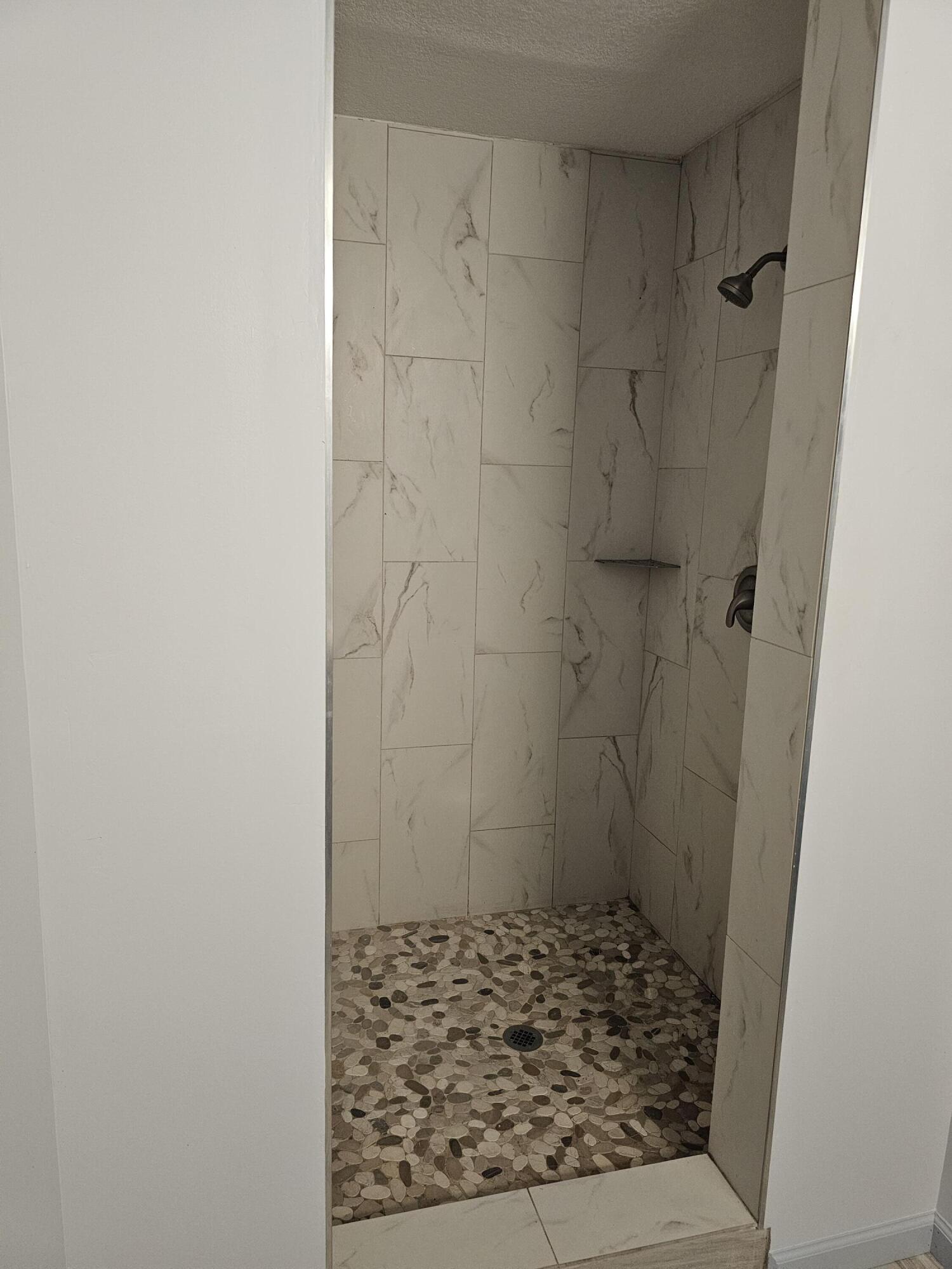 3511 Quail Ridge Drive Chipley, FL 32428 - Photo 11 of 11 a bathroom with a shower