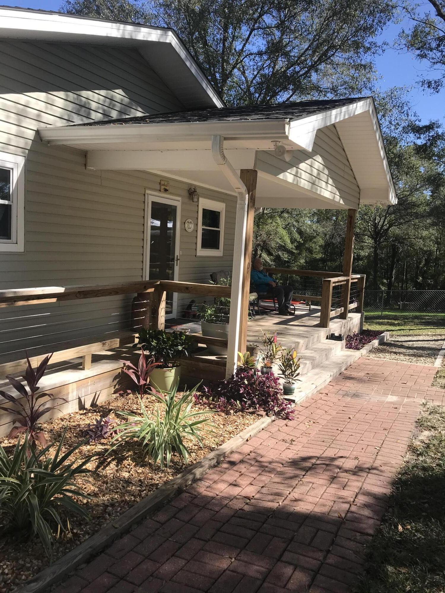 3511 Quail Ridge Drive Chipley, FL 32428 - Photo 2 of 11 a view of a house with backyard porch and sitting area