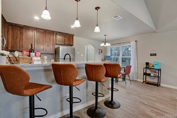 a view of a kitchen and dining area with furniture