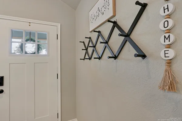 a view of an entryway with a wooden door