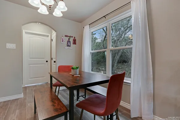 a view of a dining room with furniture window and wooden floor