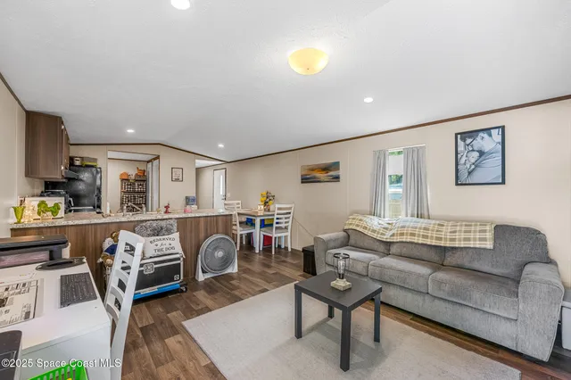 a living room with furniture a couch and a table