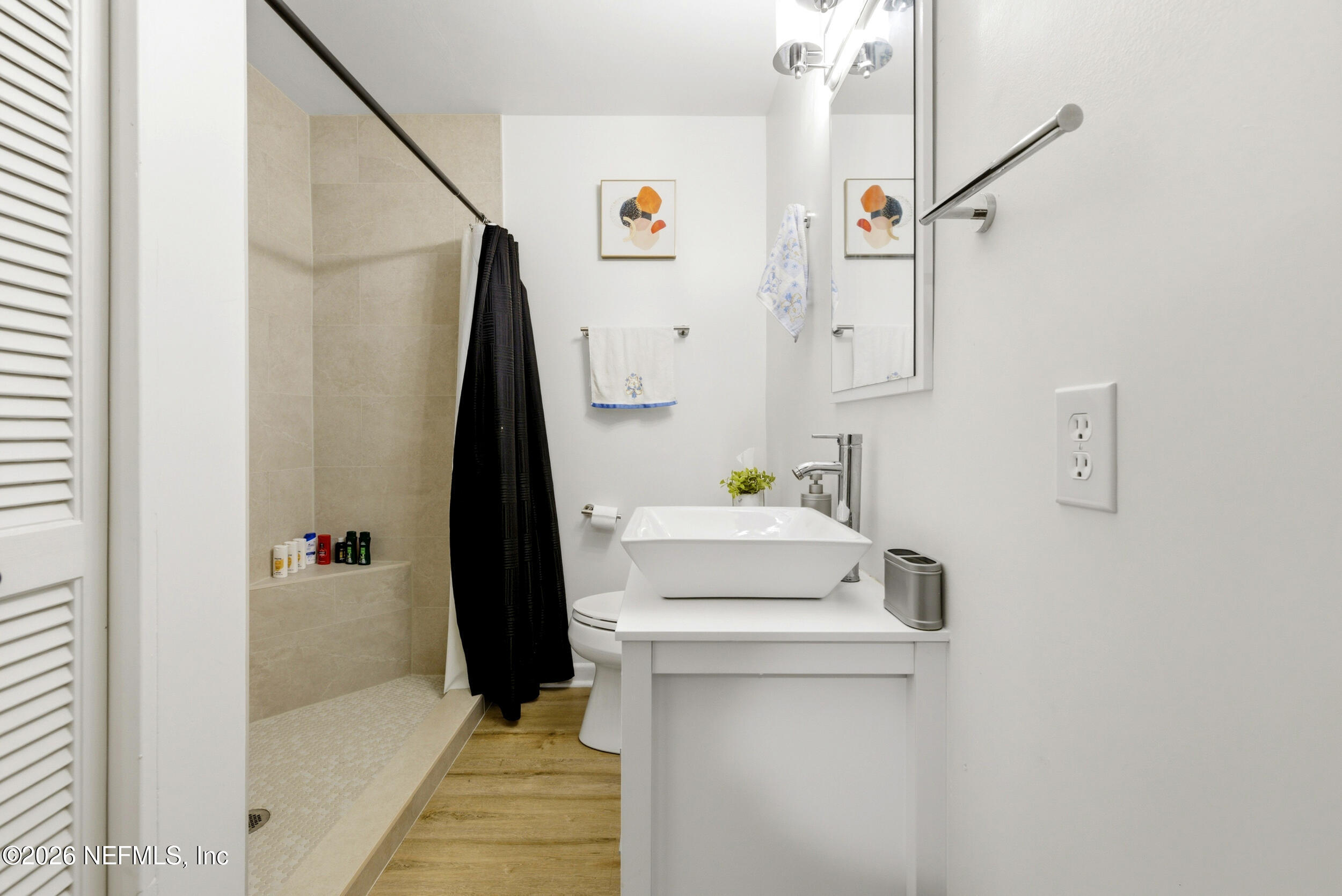 7484 Spinola Road Jacksonville, FL 32217 - Photo 37 of 63 a bathroom with a sink toilet and shower