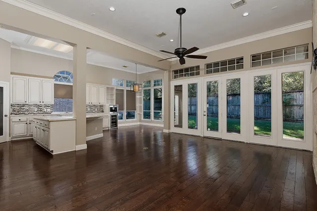 a kitchen with sink cabinets and a stove top oven