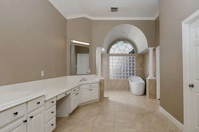 a bathroom with a bathtub and shower
