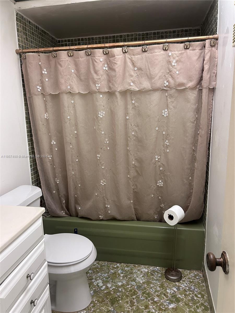 14201 Southwest 66th Street, Unit 306 Miami, FL 33183 - Photo 11 of 38 a bathroom with a sink and a toilet