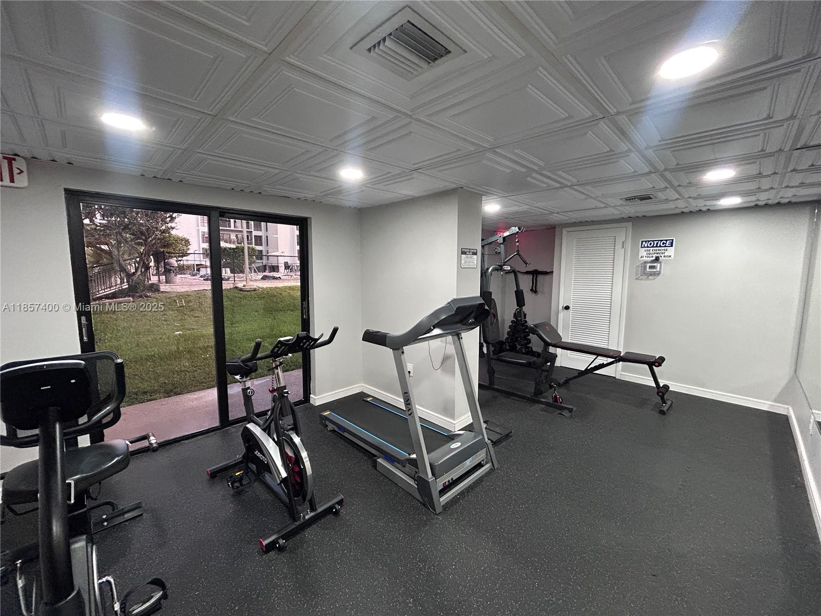 14201 Southwest 66th Street, Unit 306 Miami, FL 33183 - Photo 27 of 38 a view of a room with gym equipment