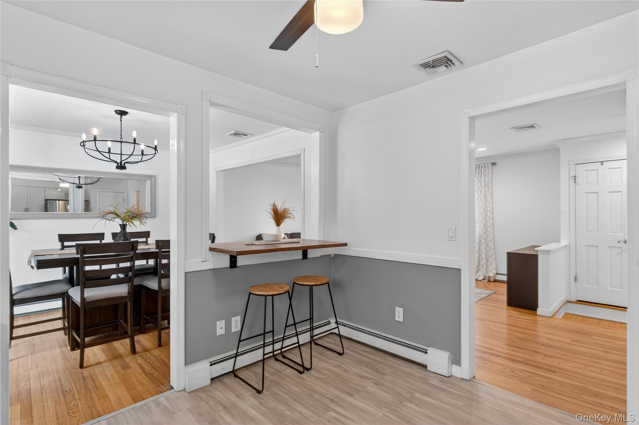 100 Watch Hill Drive Fishkill, NY 12524 - Photo 15 of 49 Dining room with light wood finished floors, a ceiling fan, hanging lights, and baseboard heating