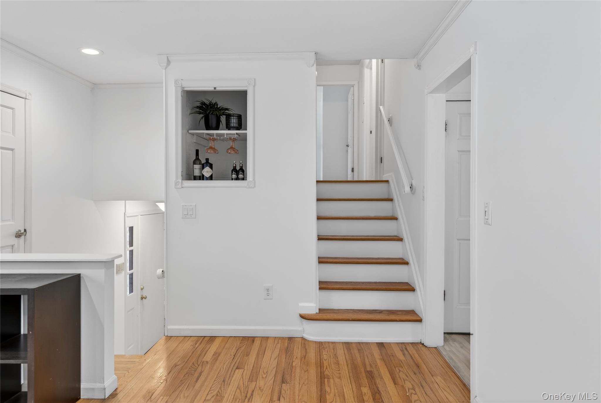 100 Watch Hill Drive Fishkill, NY 12524 - Photo 19 of 49 Staircase featuring wood finished floors, crown molding, and recessed lighting