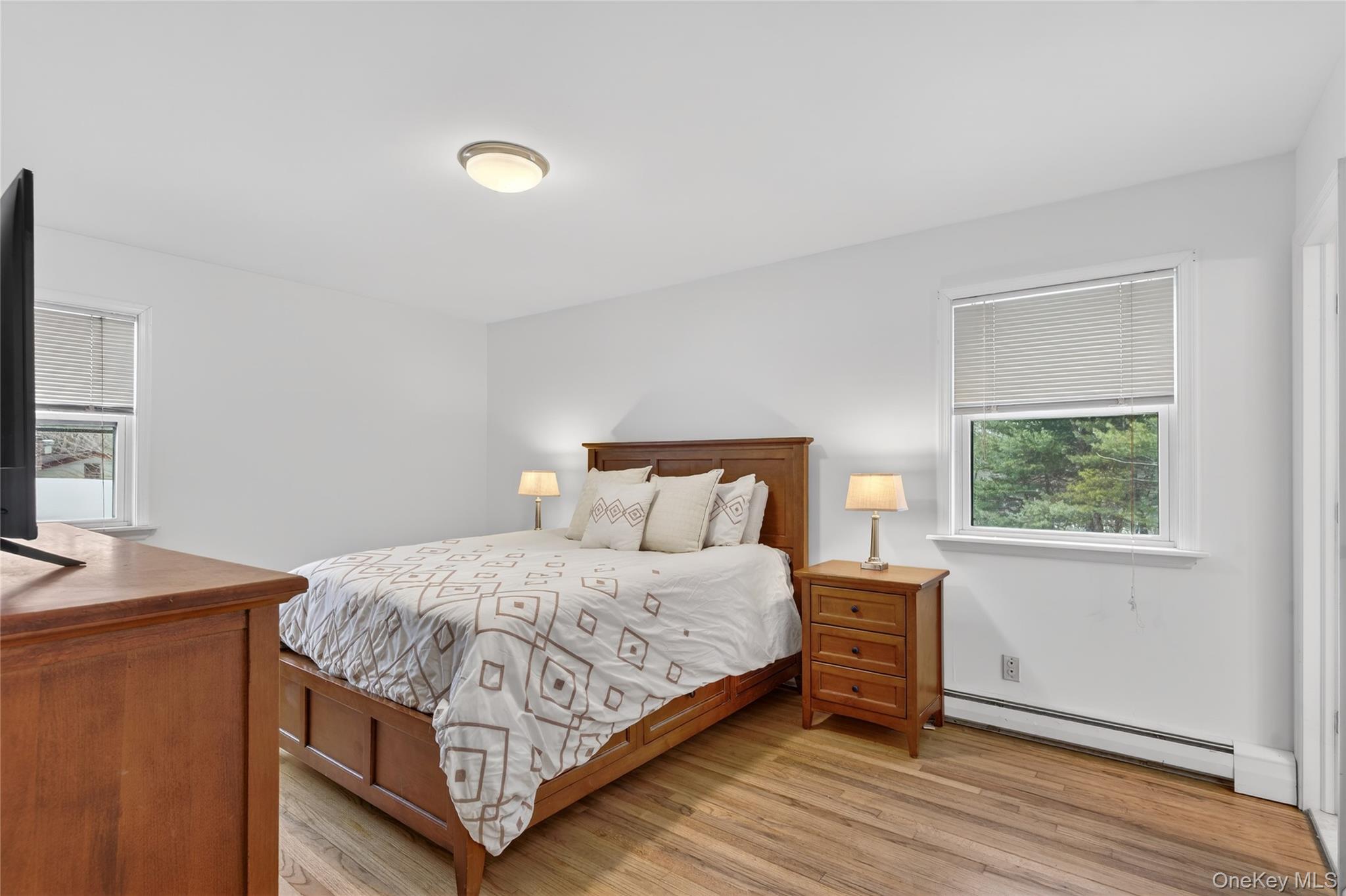 100 Watch Hill Drive Fishkill, NY 12524 - Photo 23 of 49 Bedroom with a baseboard radiator and light wood-type flooring
