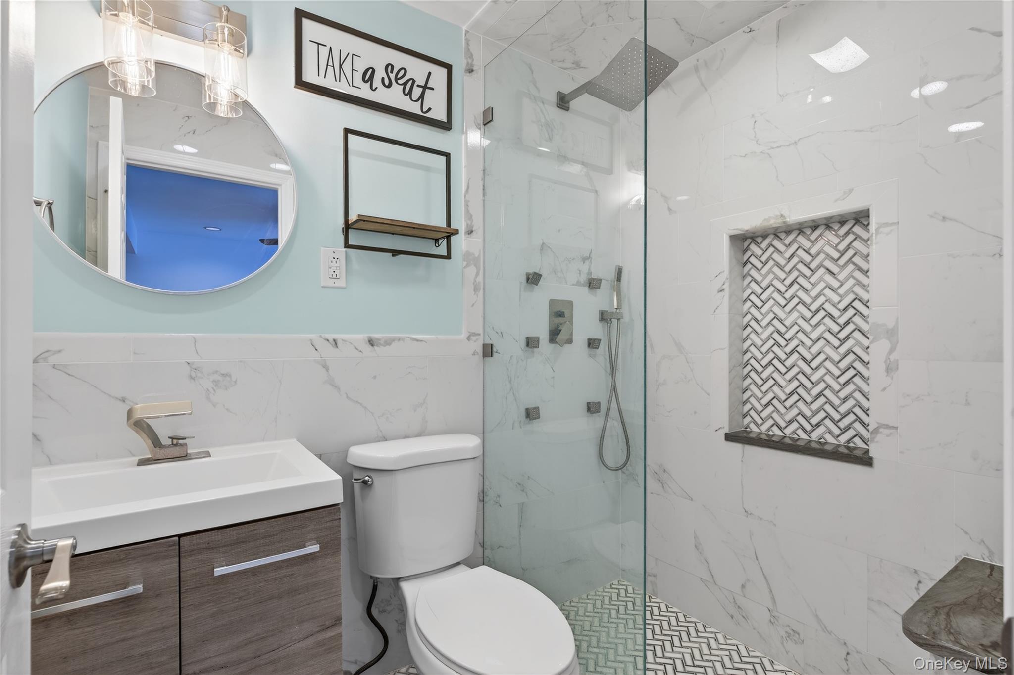 100 Watch Hill Drive Fishkill, NY 12524 - Photo 27 of 49 Full bathroom featuring vanity, a marble finish shower, tile walls, and wainscoting