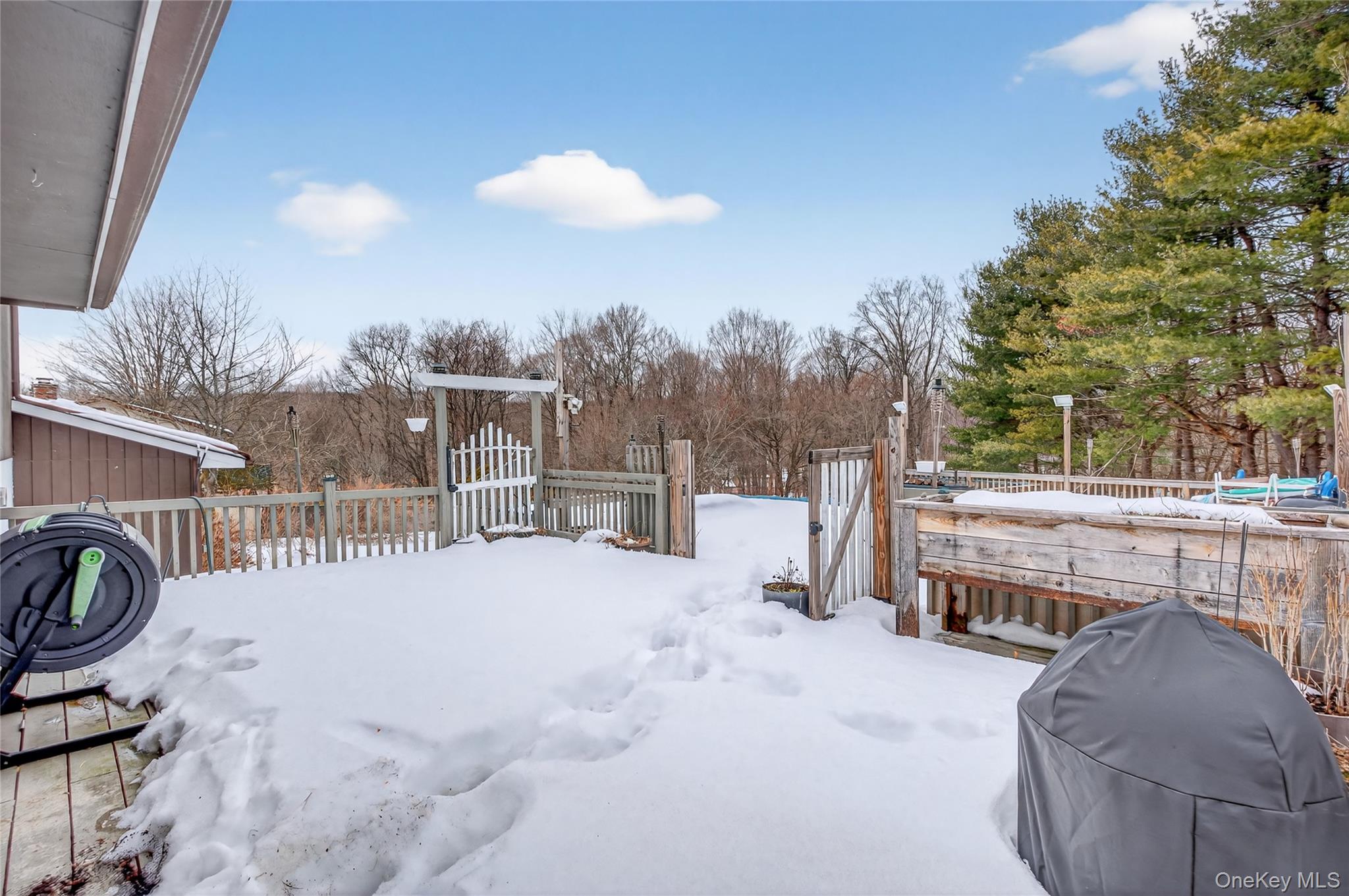 100 Watch Hill Drive Fishkill, NY 12524 - Photo 35 of 49 Yard layered in snow with a deck