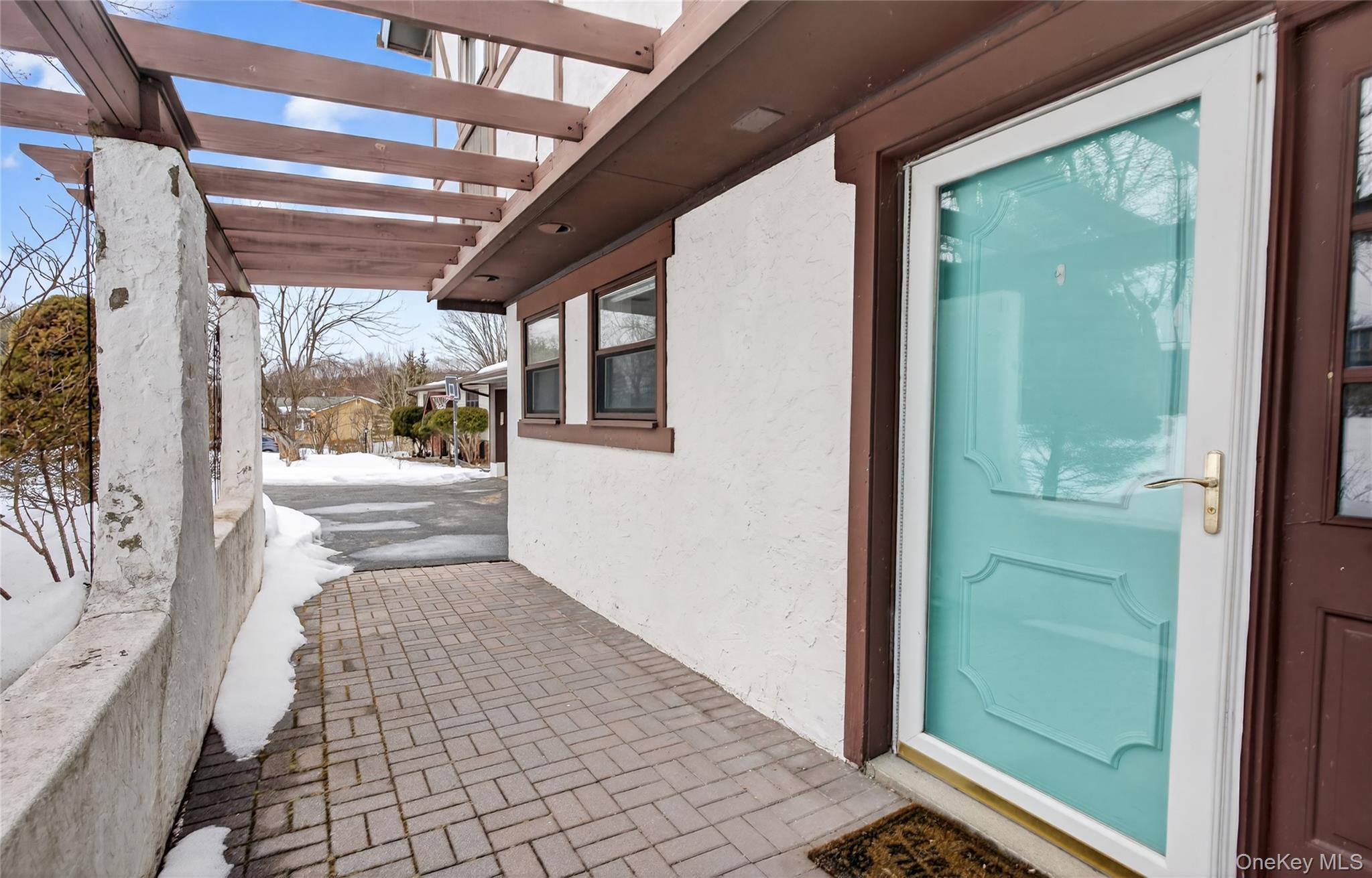 100 Watch Hill Drive Fishkill, NY 12524 - Photo 5 of 49 Entrance to property with stucco siding and a pergola