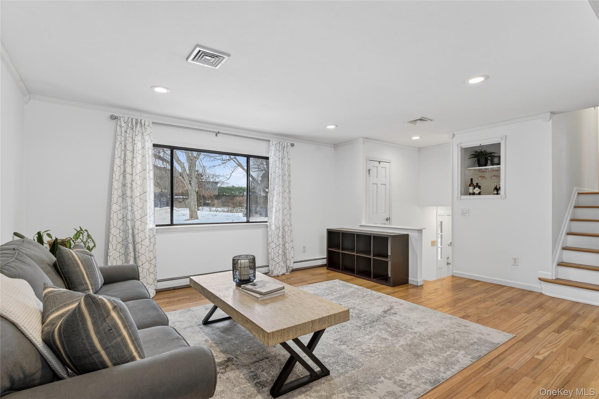 100 Watch Hill Drive Fishkill, NY 12524 - Photo 10 of 49 Living area featuring light wood-style flooring, recessed lighting, and ornamental molding