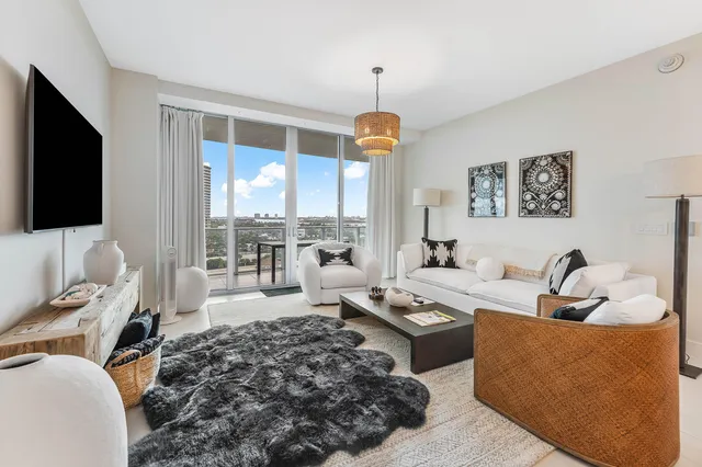 a living room with furniture fireplace and a flat screen tv